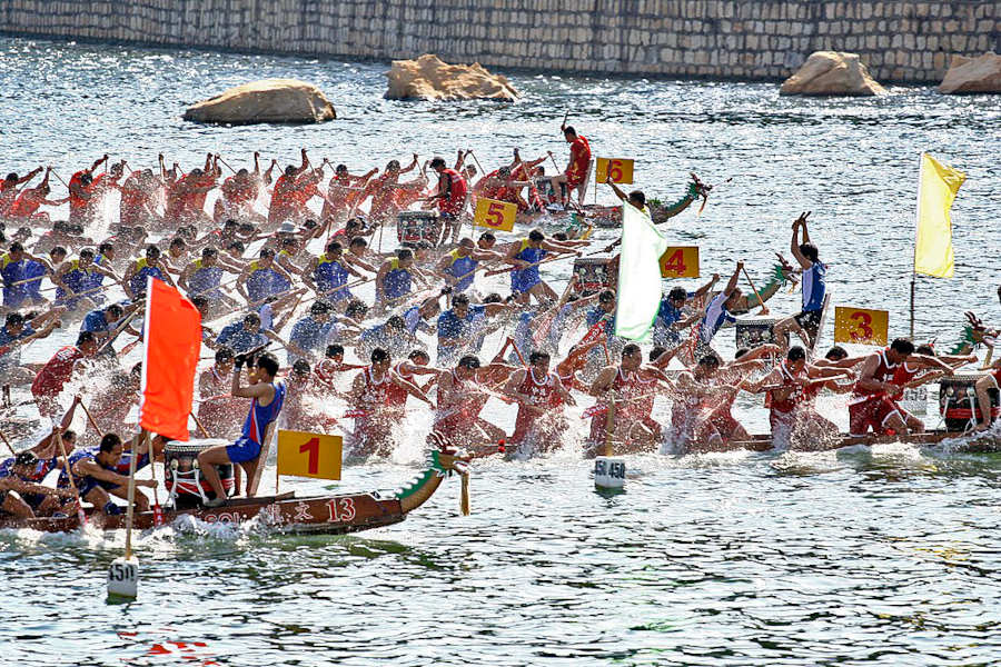 paddlers in dragon boat race