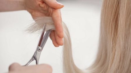 Woman getting hair cut