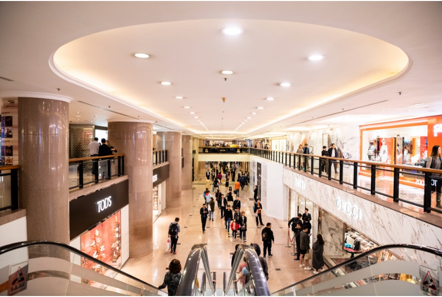 escalator leading to luxury retail stores in harbour city mall hong kong