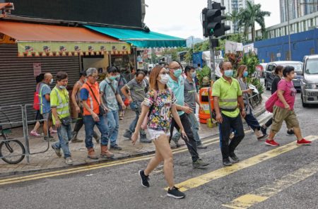 People in Hong Kong wearing masks.