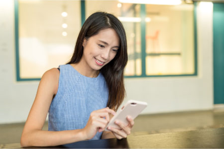 woman using smartphone in hong kong