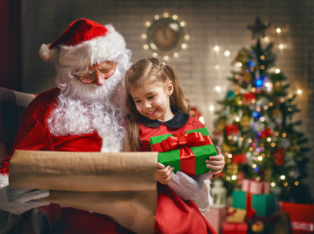 santa meeting child at santas sweet shop in island shangri-la