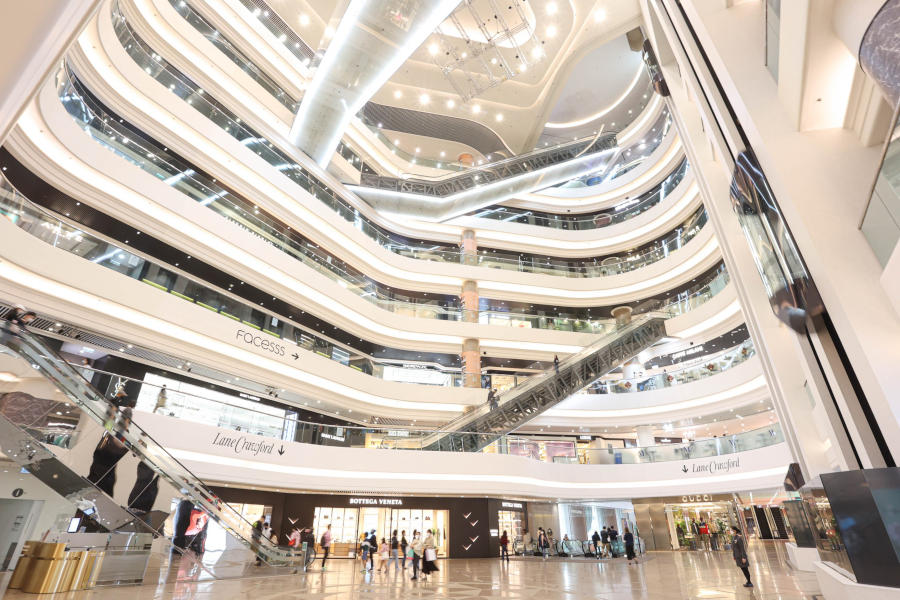 view from ground floor of multi-level shopping centre inside hong kong times square