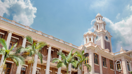 A low-angle view of the Univeristy of Hong Kong clock tower.